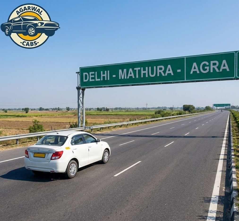 an agarwal cabs white sedan taxi driving on the yamuna expressway towards mathura, with a road sign overhead and the agarwal cabs logo in the corner.