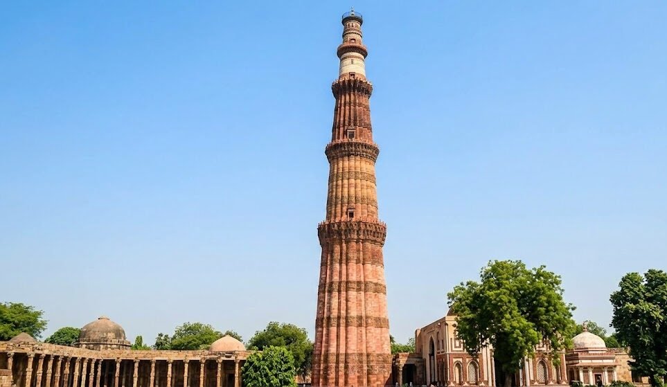 the historic qutub minar in delhi, a popular tourist attraction accessible from the airport.